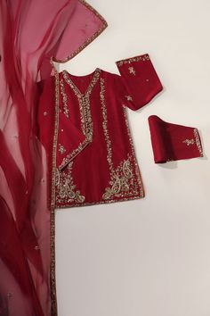 A beautiful festive look in the captivating shade of burnt orange, crafted on pure raw silk in a long kameez silhouette, heavily embellished with gold zardozi craftsmanship, each stitch is a testament to generations of artistry. Completing this masterpiece of a design is a fully embellished soft pure organza dupatta, a Red Silk Churidar With Resham Embroidery, Transitional Dola Silk Churidar With Dabka Work, Red Raw Silk Churidar With Traditional Drape, Red Raw Silk Bollywood Churidar, Semi-stitched Raw Silk Kurta With Dabka Work, Red Chanderi Kurta With Dabka Work, Red Bollywood Churidar In Raw Silk, Red Dola Silk Kurta For Eid, Transitional Raw Silk Kurta With Dupatta