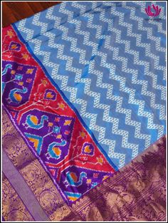 Step into this charming elegance of Kanchipuram Silk light blue saree, festooned with Ikkat pattern on its body. The blue foundation displays distinctive ikkat pattern, creating an unique and stunning look. Further it snuggled across the purple border featuring animal motif series that radiates zest for life. The vibrant purple pallu with animal motis in florals, woven in gold zari exudes perfect grandeur. The saree is accompanied by ikkat purple zari-bordered blouse, which adds opulence. Silk m Blue Art Silk Pre-draped Saree With Traditional Patterns, Transitional Blue Silk Pre-draped Saree, Blue Silk Pre-draped Saree For Traditional Ceremonies, Blue Paithani Silk Pre-draped Saree With Traditional Drape, Traditional Blue Pre-draped Saree For Festivals, Blue Tussar Silk Dupatta With Printed Border, Blue Ikat Print Traditional Wear For Navratri, Blue Unstitched Tussar Silk Lehenga, Blue Traditional Wear For Ceremonies In Transitional Season