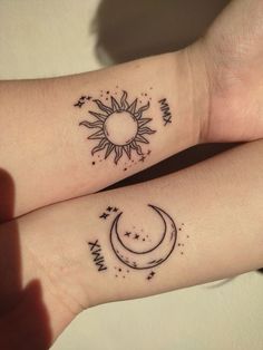 two wrist tattoos with the sun and moon on them