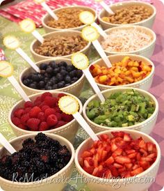 several bowls filled with different types of fruits and cereals on top of a table