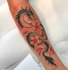 a woman with a dragon tattoo on her arm