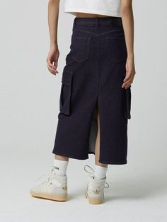 This is a comfortable and trendy skirt by MAGOODGAN that is made out of high quality cotton blend fabric. With unique design detail with trendy look, it will stand out from your casual and young daily outfit.- Rinse washed non fade denim fabric- Big pockets detail on the side- Elastic waistband- Deep vent on the back Fall Cotton Cargo Skirt With Relaxed Fit, Trendy High Waist Relaxed Fit Skirt, Trendy Long Cotton Skirt, Trendy High Waist Skirt With Relaxed Fit, Trendy Dark Wash Knee-length Skirt, Relaxed Fit Cotton Midi Denim Skirt, High Waist Cotton Cargo Skirt For Streetwear, High Waist Cotton Denim Skirt For Fall, Denim Blue Long Cotton Skirt