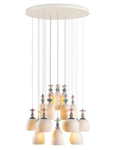 a white chandelier with many lights hanging from it's center and bottom