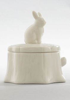 a white ceramic box with a rabbit on top