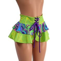 "This is the shortest version of our tiered double ruffle skirt! This 10\" long circle cut skirt has a lace-up at the waistband, and a tiered ruffle, for double the cuteness. The waistband and longer ruffle are made from Neon Lime Holographic, and the short ruffle is Glow Worm.  The laceup tie is Grape holographic. Perfect for matching with our cheekies, shorts and crops, or wear it over leggings The skirt is open below the laceup, so be sure to wear something cute underneath! (or not? ;) ) This Ruffled Bottoms For Summer Costume Party, Tiered Fitted Mini Skirt For Party, Ruffled Tiered Skirt For Costume Party, Green Ruffled Mini Skirt For Party, Green Tiered Skirt For Party, Green Tiered Party Skirt, Green Tiered Skirt Skort With Ruffles, Multicolor Tiered Mini Skirt For Party, Fitted Multicolor Ruffled Mini Skirt