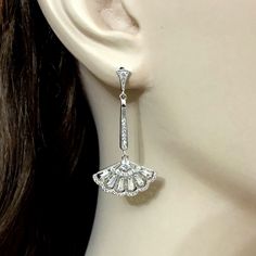 "Choose a pair of silver or rose gold cz linear bridal earrings in Gatsby Art Deco wedding style, featuring geometric fan shape dangles made of sparkly clear cubic zirconia with sterling silver posts in your choice of white, yellow and rose gold plating. Earrings are about 1 3/4\" (4.3cm) with posts. View matching pieces or similar designs at https://etsy.me/2UncS3p See all geometric designs at https://etsy.me/2eKf6s8 View all earrings at https://etsy.me/1f8VFT4" Diamond Clip-on Earrings With Sparkling Stones For Wedding, Wedding Diamond Dangle Earrings, Wedding Clip-on Earrings In Diamond White Cubic Zirconia, Wedding Diamond Dangle Earrings With Prong Setting, Wedding Clip-on Diamond Earrings With Accents, Wedding White Gold Diamond Clip-on Earrings, Elegant Hand Set Diamond Earrings For Wedding, White Gold Diamond Clip-on Earrings For Wedding, Diamond White Gold Clip-on Earrings For Wedding