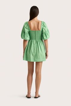 A 100% organic cotton mini dress in Apple with a fitted bodice and slightly-flared A-line skirt, gathered at the waist. A beloved FAITHFULL silhouette, it features further gathering on the front bodice and shirring at the back for additional stretch and movement. With a square neckline and elbow-length puff sleeves, elasticated at the cuff, style with a simple sandal for pop of colour in your everyday. Apple Dress, Simple Sandals, Cotton Mini Dress, Perfect White Tee, Maxi Dress Sale, Solid & Striped, Event Dresses, Fitted Bodice, A Line Skirt