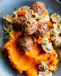 some meatballs and mashed potatoes on a plate