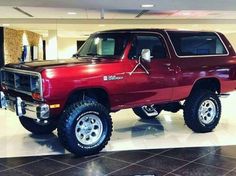 a large red truck parked inside of a building