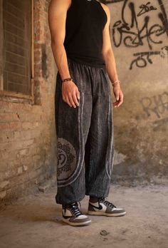 Elevate Your Festival Wardrobe with These Stunning Unisex Stonewashed Baggy Spiritual Pants! Designed for ultimate comfort and style, these unisex stonewashed baggy pants are the perfect addition to your festival wardrobe and everyday look. Crafted from sustainable, eco-friendly cotton, these trousers are ideal for those who value both fashion and the environment. Whether you're dancing at a festival, flowing through yoga, or simply embracing your free-spirited lifestyle, these pants will keep y Casual Black Cotton Harem Pants, Full-length Cotton Harem Pants For Streetwear, Full Length Cotton Harem Pants For Streetwear, Full-length Cotton Harem Pants With Pockets, Cotton Full Length Harem Pants For Streetwear, Comfortable Full-length Cotton Bottoms, Spring Festival Cotton Pants, Comfortable Relaxed Fit Black Harem Pants, Summer Cotton Relaxed Fit Harem Pants