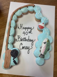 a birthday card with cupcakes in the shape of fishing rods and fish on it