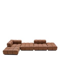 a set of four brown leather couches with one reclining and the other reclining