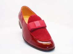 Style: 525-210SP-Red Exquisite combination of Patent Leather & Suede accent this slip-on Dress Loafer from Carrucci, featuring Grosgrain Bow and Piping, and a clean welt! Formal Slip-on Loafers With Red Sole, Red Slip-on Loafers With Plain Toe, Red Round Toe Slip-ons For Formal Occasions, Red Formal Slip-ons With Round Toe, Red Round Toe Formal Slip-ons, Semi-formal Red-sole Slip-on Dress Shoes, Red Leather Loafers For Semi-formal Occasions, Red Round Toe Loafers For Semi-formal Occasions, Classic Red Loafers For Semi-formal Occasions