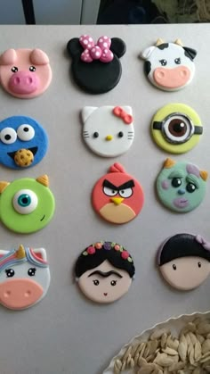 there are many different kinds of magnets on the refrigerator door, including angry birds and hello kitty