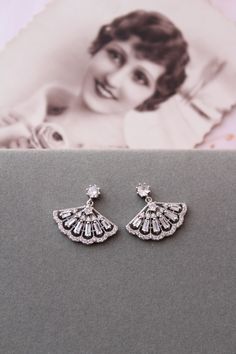 Small  vintage style  earrings   Colour: rhodium(silver tone) /clear. Measurements: approx 21 mmx20mm (small and delicate).  Materials:  rhodium over brass components, micro pave zircon crystals. Stud earrings. Great for wedding or other celebration. MORE SAME STYLE: https://www.etsy.com/uk/shop/BridalArtDeco?ref=listing-shop-header-item-count&section_id=23918122 Please note some images have been enlarged to allow for details to be shown. Read the descriptions for details on actual size of each Silver Art Deco Diamond Drop Earrings, Nickel-free Sterling Silver Wedding Crystal Earrings, Vintage Chandelier Earrings For Wedding, Sterling Silver Nickel-free Crystal Earrings For Wedding, Vintage Wedding Chandelier Earrings For Pierced Ears, Wedding Sterling Silver Nickel-free Crystal Earrings, Elegant Pierced Cluster Earrings For Wedding, Sterling Silver Diamond Earrings For Wedding, Classic Sterling Silver Bridal Earrings For Party