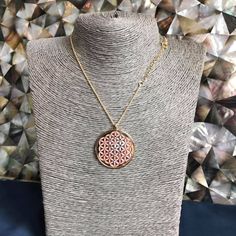 "Flower of Life in 24 carat gold on 925 silver, rose mother of pearl and crystals Sephiroth. Found in the most sacred places on Earth, its pattern evocates each form in nature as it is known. For the first time it appeared in the Temple of Osiris built in 1650 ac. Its shapes hidden the fruit of life and it presents a triangolar lattice form, with circle radii equal to their separation is called a seven overlapping circles grid. It contains six circles intersecting at a point, with a seventh circ Rose Gold Medallion Amulet Necklace, Rose Gold Medallion Necklace In Amulet Style, Rose Gold Pendant Medallion Necklace As Gift, Rose Gold Medallion Pendant Necklace As Gift, Rose Gold Jewelry With Large Pendant As Gift, Rose Gold Locket Necklace For Mom, Elegant Medallion Pendant Necklace Gift, Handmade Rose Gold Medallion Necklace, Pink Gold Plated Round Necklace