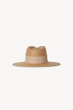 Details Crafted from packable straw, the Clemence fedora is finished with a thick, tonal leather band and signature gold monogram screw. This style is meant for traveling with you wherever you go whether in a suitcase, a purse, or beach bag. · Brim: 3.75"· Crown: 3.75"· 1 5/8" Leather Band· Gold Screw Closure· Made in the USA Fit Runs true to size. If between sizes, we suggest sizing up. Packable Hat, Janessa Leone, Straw Fedora, Gold Monogram, Straw Bags, Virtual Fashion, Blanket Scarf, Wool Hat, Knitted Bags