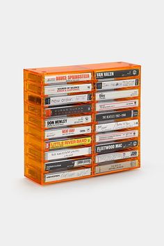 a stack of cassettes sitting on top of each other in front of a white background