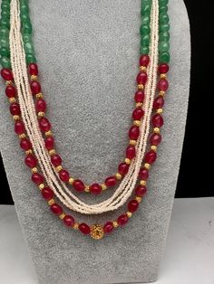 Ruby Emerald Pearls Nakshi Multi Layer Necklace Only Neckalce no earringsColor : GoldenSize : Necklace Length : 22 Inches Approx;Stones : Pearl Real Emeralds Nakshi Balls