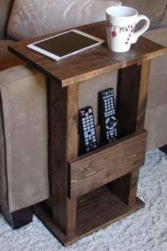 a small table with magazines on it and a coffee cup sitting on top of it