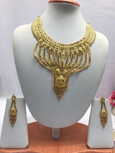 "Handmade Indian Bridal Wedding Jewelry 22ct Heavy Gold Plated Necklace Set with Earrings Indian Jewelry Indian Bollywood Jewelry , its Artificial Jewelry  Type :22ct Gold Plated Necklace Set Earrings Length: 2.5\"inches Approx Shape - As Shown in Picture It is a perfect match with formal attire on special occasions or with casual wearing The item will come with the clear plastic box or plastic bag and packaging Traditional Indian Wedding Jewellery Slight Colour variations possible due to differ Gold Plated Jewelry Sets For Marriage, Gold Bridal Necklace With Intricate Design For Marriage, Gold Chandbali Bridal Set For Marriage, Gold Round Bridal Necklace For Marriage, Gold Bridal Necklace Hand Set For Wedding, Gold Bridal Sets With Tilla For Formal Occasion, Gold Bridal Sets For Festivals And Celebrations, Gold Bridal Sets For Festive Celebrations, Formal Gold Bridal Sets With Tilla