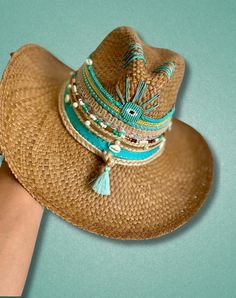 Introducing the Colombian Hat, a stunning Summer Straw Hat that effortlessly captures the essence of tropical elegance. Perfect for sun-soaked days, this Panama Hat is expertly crafted from raffia, making it a durable and eco-friendly choice. It's not just a Womens Sun Hat; it's a statement piece of artisanal craft, blending tradition with contemporary style. This handmade straw hat stands out with its gorgeous embroidered design, complete with fringes, tassels, and beads, making it more than just a beach hat--it's a piece of wearable art. The wide brim provides ample protection from the sun, ensuring every beach outing or festival is as comfortable as it is stylish. With its boho hat appeal, this hat seamlessly fits into any casual, artistic wardrobe, perfect for those who love a laid-bac Bohemian Headpiece, Bohemian Hats, Summer Straw Hat, Womens Fedora, Boho Hat, Sun Hats For Women, Hat Stands, Summer Attire, Trendy Accessories