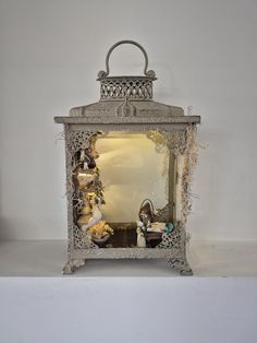 an old fashioned mirror sitting on top of a shelf