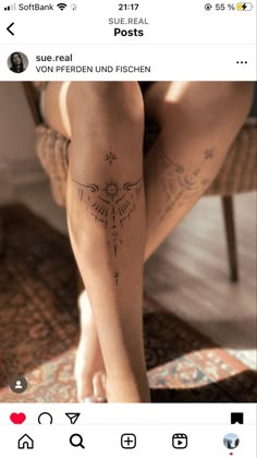 a woman's leg with tattoos on it