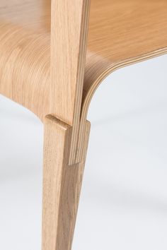 a close up of a wooden chair on a white background with no one around it