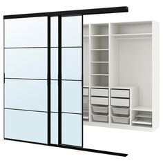 an open white closet with drawers and shelves