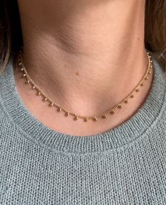 Enhance your sophisticated look with our Dots gold necklace. Crafted with gold fill for a luxurious touch, this adjustable necklace can be styled to your desired length. Elevate your style with this exclusive piece, perfect for adding an elegant touch to any outfit. Delicate 14k Gold Filled Lariat Jewelry, Delicate 14k Gold Jewelry With Adjustable Chain, Rose Gold 14k Gold-filled Jewelry With Adjustable Chain, Minimalist Choker Jewelry With Adjustable Length, Minimalist Adjustable Choker Jewelry, Adjustable Tarnish-resistant Choker Jewelry, Adjustable Tarnish-resistant Choker Necklace, 14k Gold-filled Chain Necklace With Round Pendant, 14k Gold Filled Jewelry As Gift