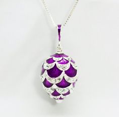 "Large rich purple 3 D pendant with clear crystals, enameled over solid sterling silver, created in our NJ shop in the tradition and spirit of Faberge jewelry.   The pendant is about 1.00\" (24 mm ) without a bail for a chain.  We make it in a verity of colors, so don't hesitate to ask for your favorite tone. Just keep in mind that we will need 1 to 4 weeks to make a new piece if we do not have it in stock.   It comes with 18\" sterling silver chain and in a gift box. If you feel that you need a Silver Enamel Teardrop Jewelry, Purple Enamel Pendant Jewelry, Purple Enamel Necklace For Gift, Purple Enamel Necklace For Gifts, Silver Enamel Necklace For Anniversary, Purple Necklace With Polished Finish As Gift, Nickel-free Purple Enamel Jewelry, Silver Enamel Locket Necklace, Egg Necklace