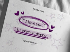 an open book with the words i love you in purple ink on it and stars