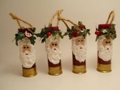 four christmas decorations made out of wine bottles with santa's beards and holly