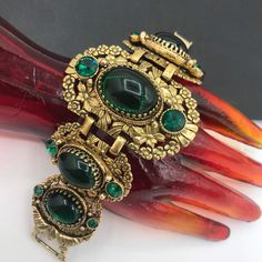 995.60 USD 1960's Green Rhinestone Bracelet, Victorian Revival Bracelet, Chunky High End Jewelry 1950s Collectible Accessories, Vintage Gift For Her Just love this bracelet that is in excellent well cared for vintage condition. Has a really nice look to it. Very nice addition to any collectible mid-century collection. For more purses.... https://www.etsy.com/shop/MartiniMermaid?ref=listing-shop2-all-items-count§ion_id=8097288 For more bracelets ......… 80s Vintage Jewelry, Vintage Wedding Jewelry With Stones, Vintage Bracelet Jewelry For Vintage Events, Collectible Vintage Jeweled Jewelry, Vintage Adjustable Jeweled Bracelets, Vintage Jewelry With Stone Setting, Retro Metal Jewelry, Vintage Evening Jewelry With Stones, Antique Metal Jewelry For Party