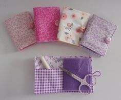 four pieces of fabric and scissors on a white table with pink, purple, and green flowers