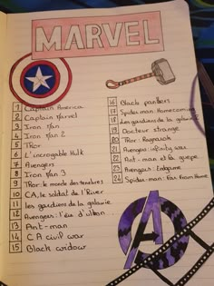 an open notebook with writing on it and pictures of captain america's symbols in the pages