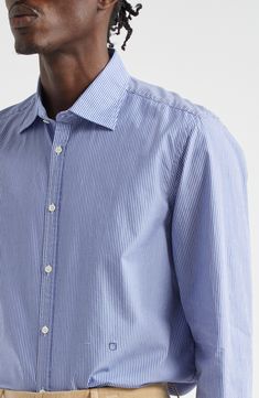 Cut from lightweight, breathable cotton, this softly relaxed button-up shirt is designed with a narrow, slightly pointed yoke in back. 31 1/2" length; 43" chest (size Medium) Front button closure Spread collar Long sleeves with button cuffs 100% cotton Dry clean or machine wash, line dry Made in Italy Designer Clothing