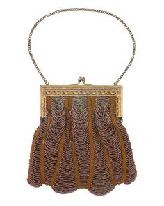 This beautiful little bag was probably made in the 1910s or 1920s. The tiny glass beads are draped in between vertical lines of crochet and attached to a metal frame. A lovely collectors piece or accessory for a Flapper style or Art Nouveau/Deco look. Details: The crocheted beading has been secured to the gold tone frame on the inside using metallic fibres and the crochet thread. The frame is engraved in an Art Nouveau pattern and has a kiss clasp to close. The inside is lined in an apple green Vintage Beaded Shoulder Bag, Antique Beaded Purse, Antique Beaded Evening Bag, Vintage Beaded Clutch Bag, Vintage Black Beaded Evening Bag, Art Nouveau Pattern, Flapper Style, Thread Crochet, Antique Glass