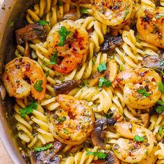 pasta with shrimp and mushrooms in a pan