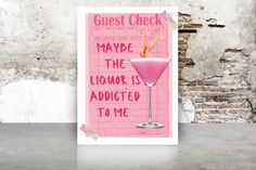 a pink poster with the words guest check and a cocktail in it on a table