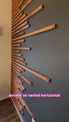 the wall is made out of wood and has many wooden strips on it, along with a quote that reads accent so varied horizontal