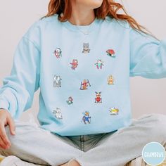 Get ready to hit the slopes in adorable style with our Skiing Comfort Colors Sweatshirt! This winter wonder showcases cute little animals hitting the slopes, adding a whimsical touch to your skiing adventures. Made from soft and cozy fabric, this sweatshirt is perfect for showcasing your love for both winter sports and charming critters. Embrace the snowy vibes with our playful and stylish Skiing Comfort Colors Sweatshirt - where cute meets comfort on the slopes! Luxurious comfort and style are what this unisex, garment-dyed sweatshirt is all about. It's made with 80% ring-spun cotton and 20% polyester and the fabric is 3-end garment-dyed, ring-spun, color-blast fleece with a 100% cotton face. Each sweatshirt comes with a relaxed fit, a rolled-forward shoulder, and a back neck patch.  .: 8 Playful Relaxed Fit Long Sleeve Sweatshirt, Playful Winter Crew Neck Sweatshirt, Playful Crew Neck Winter Sweatshirt, Playful Crew Neck Hoodie For Winter, Playful Relaxed Fit Winter Tops, Playful Relaxed Fit Tops For Winter, Fun Winter Crew Neck Sweatshirt, Fun Crew Neck Winter Sweatshirt, Fun Blue Crew Neck Sweatshirt