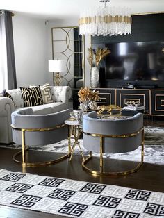 a living room filled with furniture and a flat screen tv on top of a wall