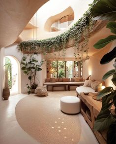 a living room filled with lots of furniture and plants