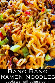 a close up of some noodles and vegetables in a bowl with the words bang bang ramen noodles