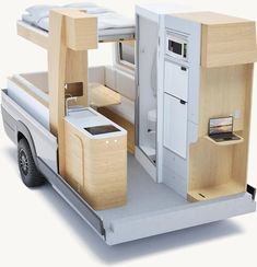 a white truck with a bed and kitchen in it's back end is shown