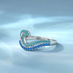 The design of this promise ring is made of two layers of wave design, the upper layer is light blue, the lower layer is dark blue, very vivid expression of the wave in your finger with gradient color. Wear this pave wave ring to the beach in the summer, will definitely have a more fashionable sense. This Promise ring is also suitable daily or official occasion, simple and cool.Material: 925 SilverPlating Color: Silver Ocean-inspired Blue Ring For Gift, Ocean-inspired Blue Ring For Gifts, Ocean-inspired Blue Rings As Gifts, Blue Ocean-inspired Jewelry For Anniversary, Ocean-inspired Blue Jewelry For Anniversary, Adjustable Blue Rings For Promise, Adjustable Blue Promise Rings, Wave Ring, Pave Ring