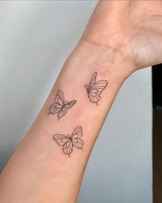 three butterflies tattoo on the wrist