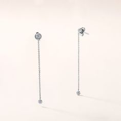 Crafted in 1.21 grams of 14K White Gold, the earrings features 28 stones of Natural Diamonds with a total weight of 0.05 carats, graded as E-F color and I1-I2 clarity. 21 Grams, Drop Dangle Earrings, Certificate Of Authenticity, Natural Diamonds, Dangle Drop Earrings, Dangle Earrings, Diamonds, White Gold, Chain